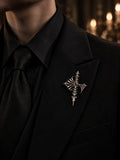 Gothic cathedral skeleton cross lapel pin in 925 sterling silver styled on a black men's tailored suit jacket by Kurga Atelier for dark academia aesthetic and gothic formalwear.