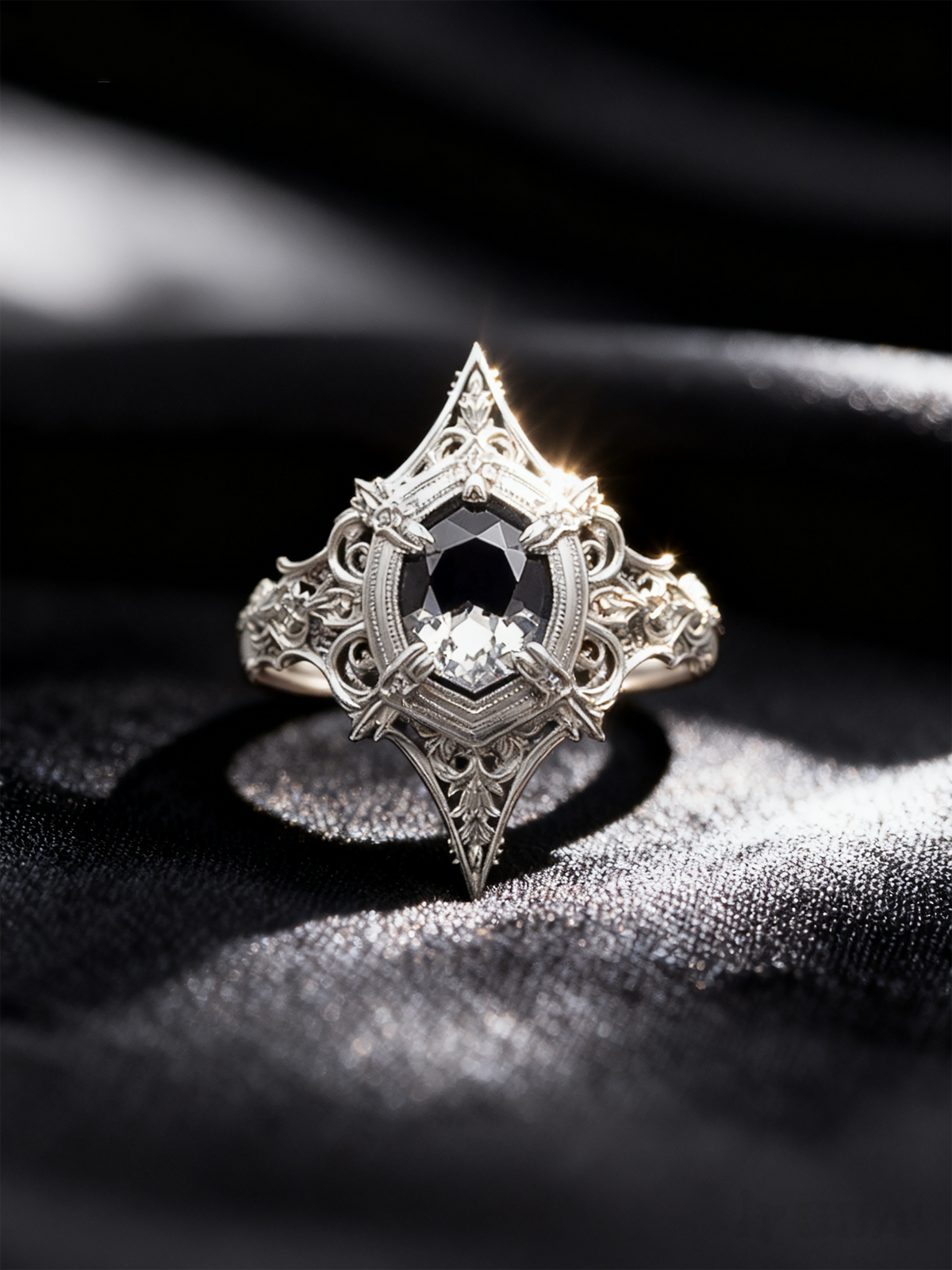 High contrast photo of Kurga Atelier gothic engagement ring. Intricate sterling silver filigree cathedral ring with a kite cut black gemstone centerpiece.