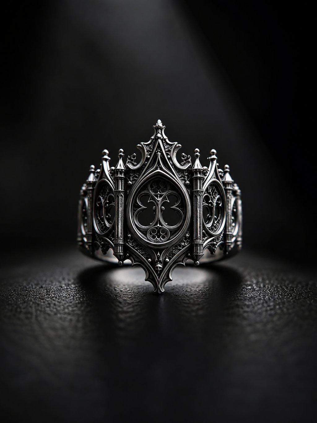 Front angle view of Kurga Atelier gothic cathedral silver band on a clean dark surface, unique alternative engagement ring for women and men.