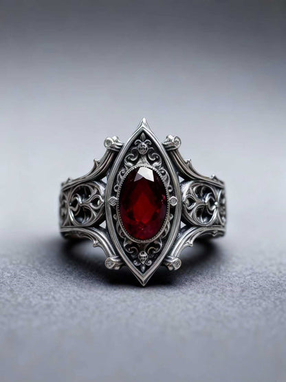 Kurga Atelier Gothic Ruby Sterling Silver Ring solo, grey background highlights vintage carvings.