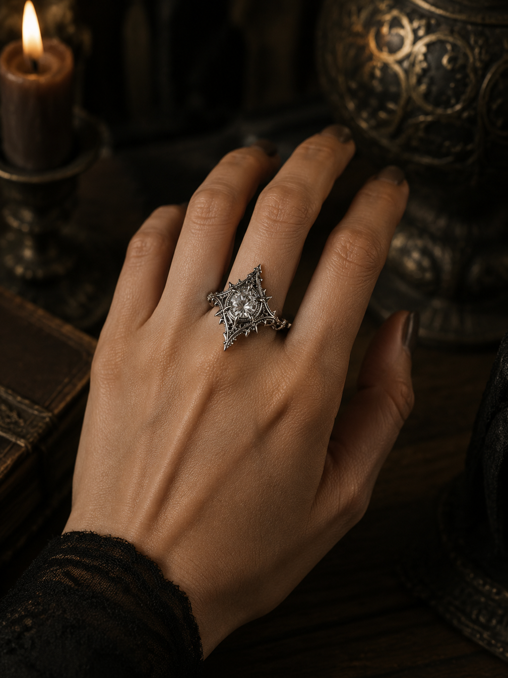 Model wearing a gothic moissanite cathedral ring on hand, featuring dark academia style, Victorian carved silver band, and alternative bride statement aesthetic.