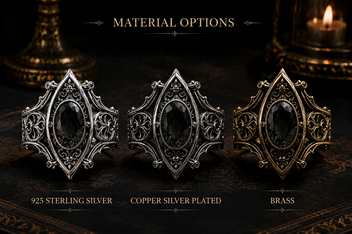 Kurga Atelier Gothic ring material options: Sterling Silver, Gold Brass, and Dark Gunmetal Grey with black stones on a dark table.