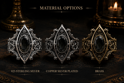 Kurga Atelier Gothic ring material options: Sterling Silver, Gold Brass, and Dark Gunmetal Grey with black stones on a dark table.