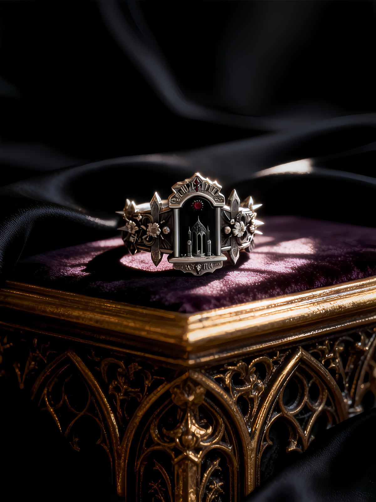 Victorian gothic statement ring showcased on an ornate vintage wooden jewelry box with dark satin background.
