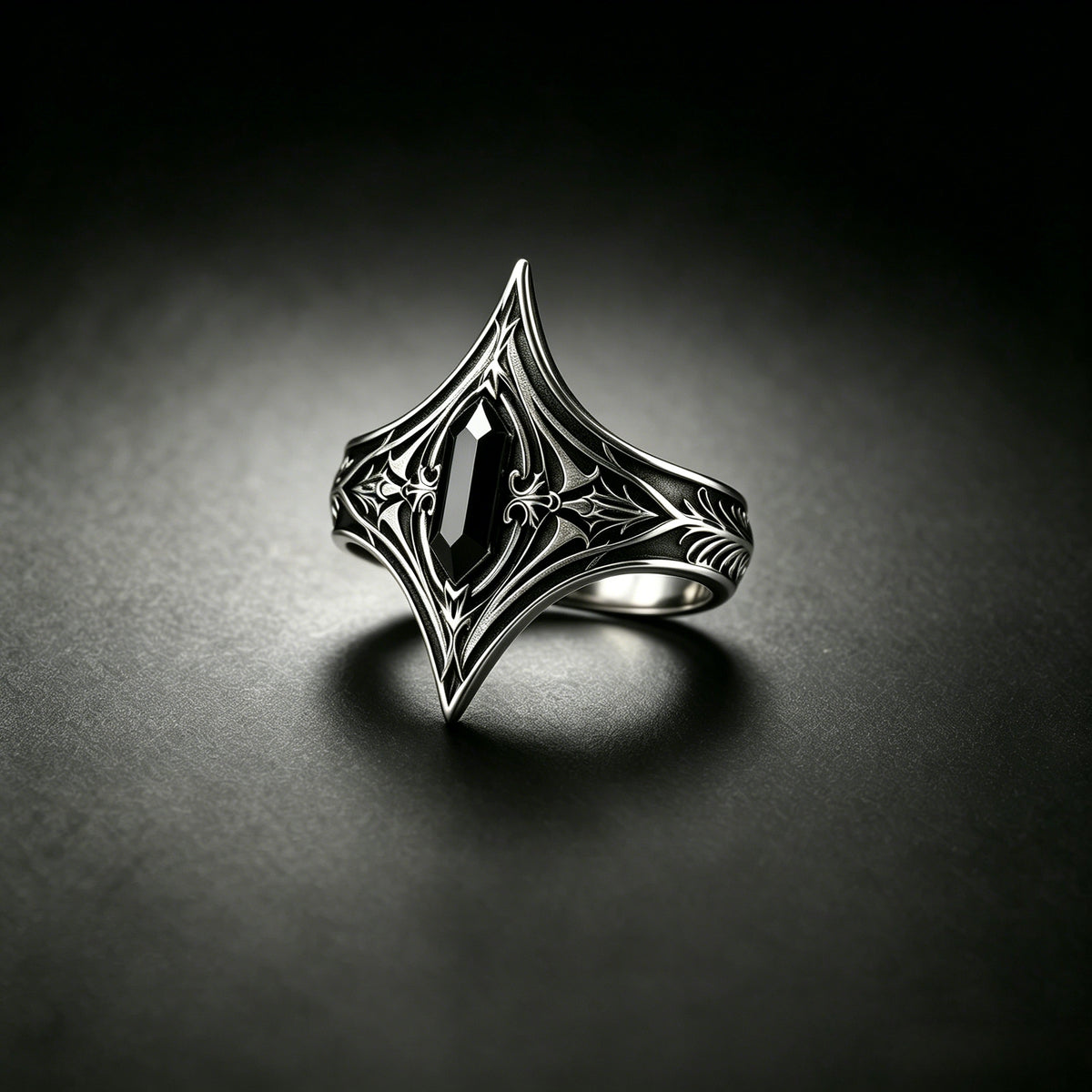 Kurga Atelier dark academia armor ring featuring a black stone set in oxidized sterling silver. Gothic statement ring on dark mysterious background.