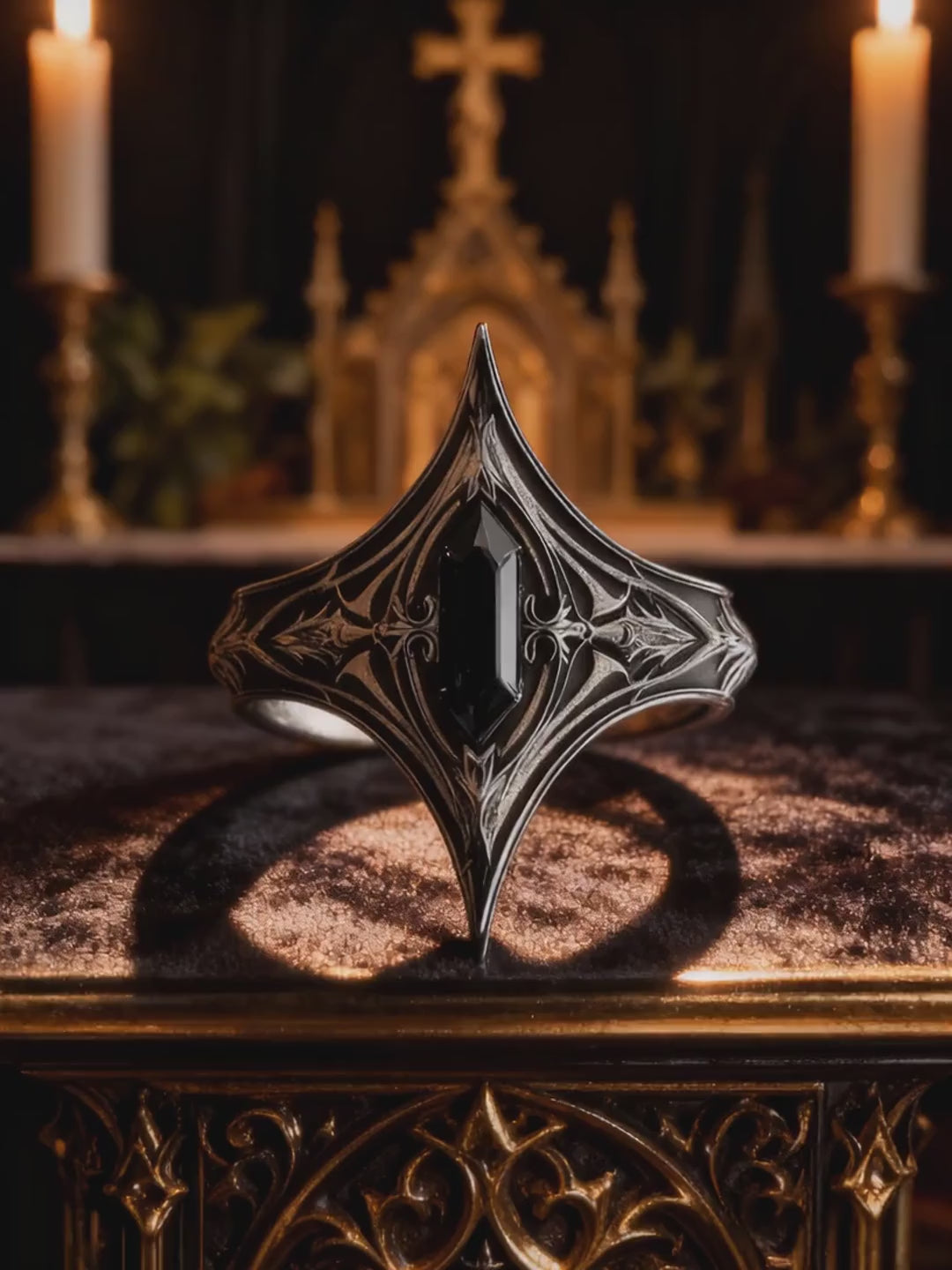 Video of Kurga Atelier gothic onyx silver cathedral ring displayed on an altar with candles. Detailed showcase of oxidized dark academia statement jewelry.