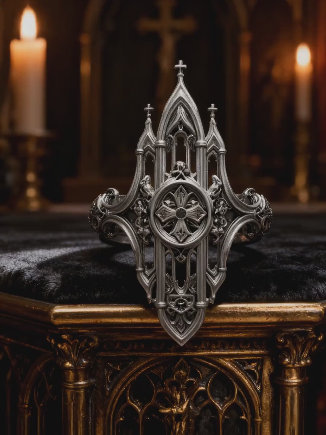 Video preview showing 360 view of Kurga Atelier Gothic cathedral architecture ring. Showcases detailed oxidized silver spires, filigree arches, and center medieval cross charm under dramatic candlelight.