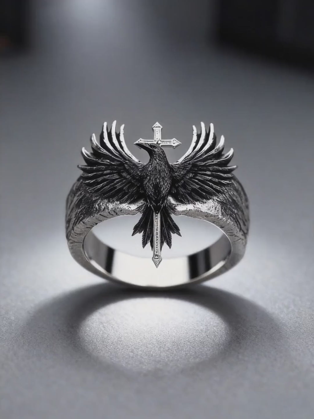 360-degree dynamic video showcase of the Kurga Atelier heavy silver raven cross ring, highlighting tactile feather carved textures and metallic reflections.