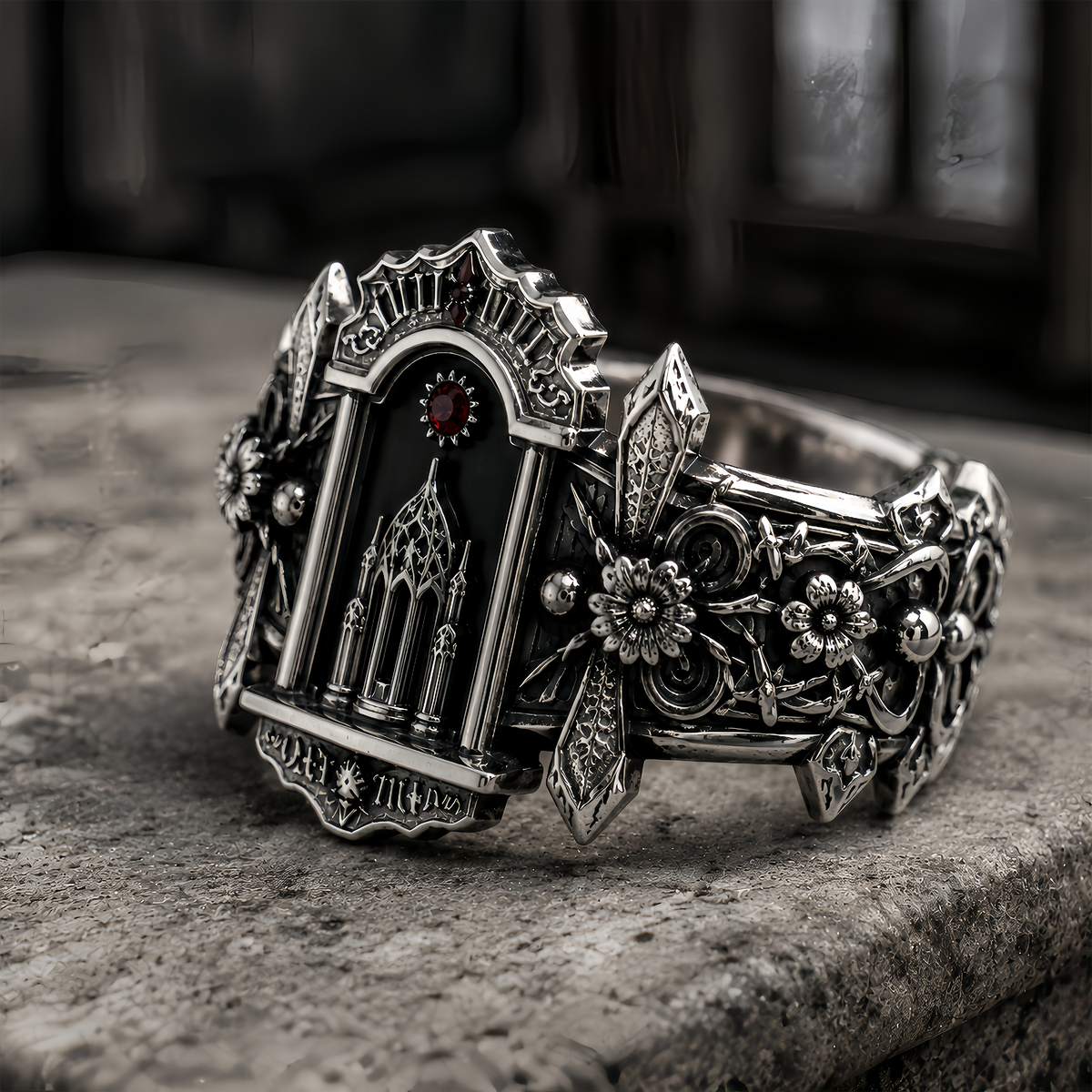 Side perspective of chunky gothic ring showing intricate oxidized silver craftsmanship and medieval architectural details.