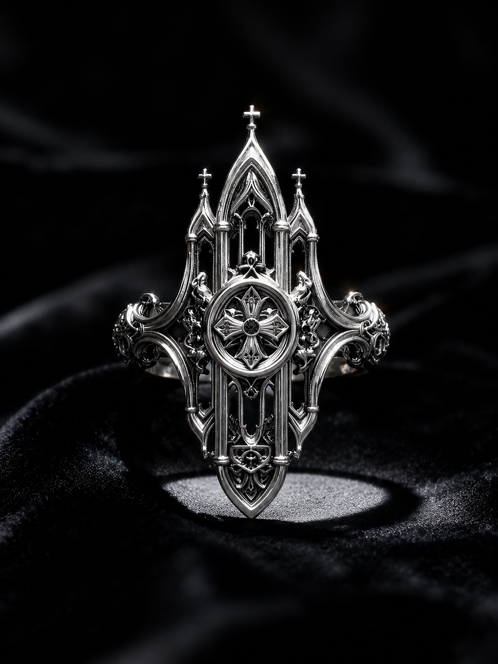 Kurga Atelier Gothic cathedral architecture ring illuminated on a black velvet background. Highlights the intricate miniature church spires and oxidized filigree silver details under spot lighting.
