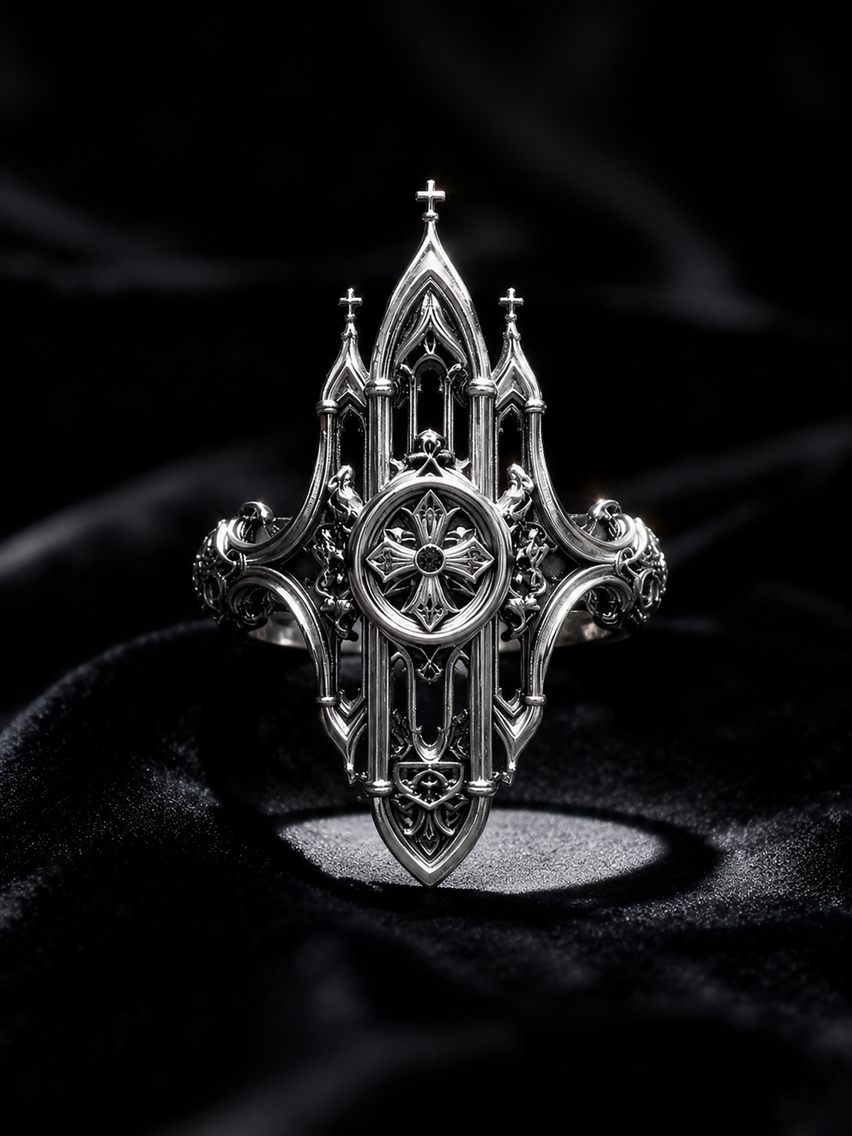 Kurga Atelier Gothic cathedral architecture ring illuminated on a black velvet background. Highlights the intricate miniature church spires and oxidized filigree silver details under spot lighting.