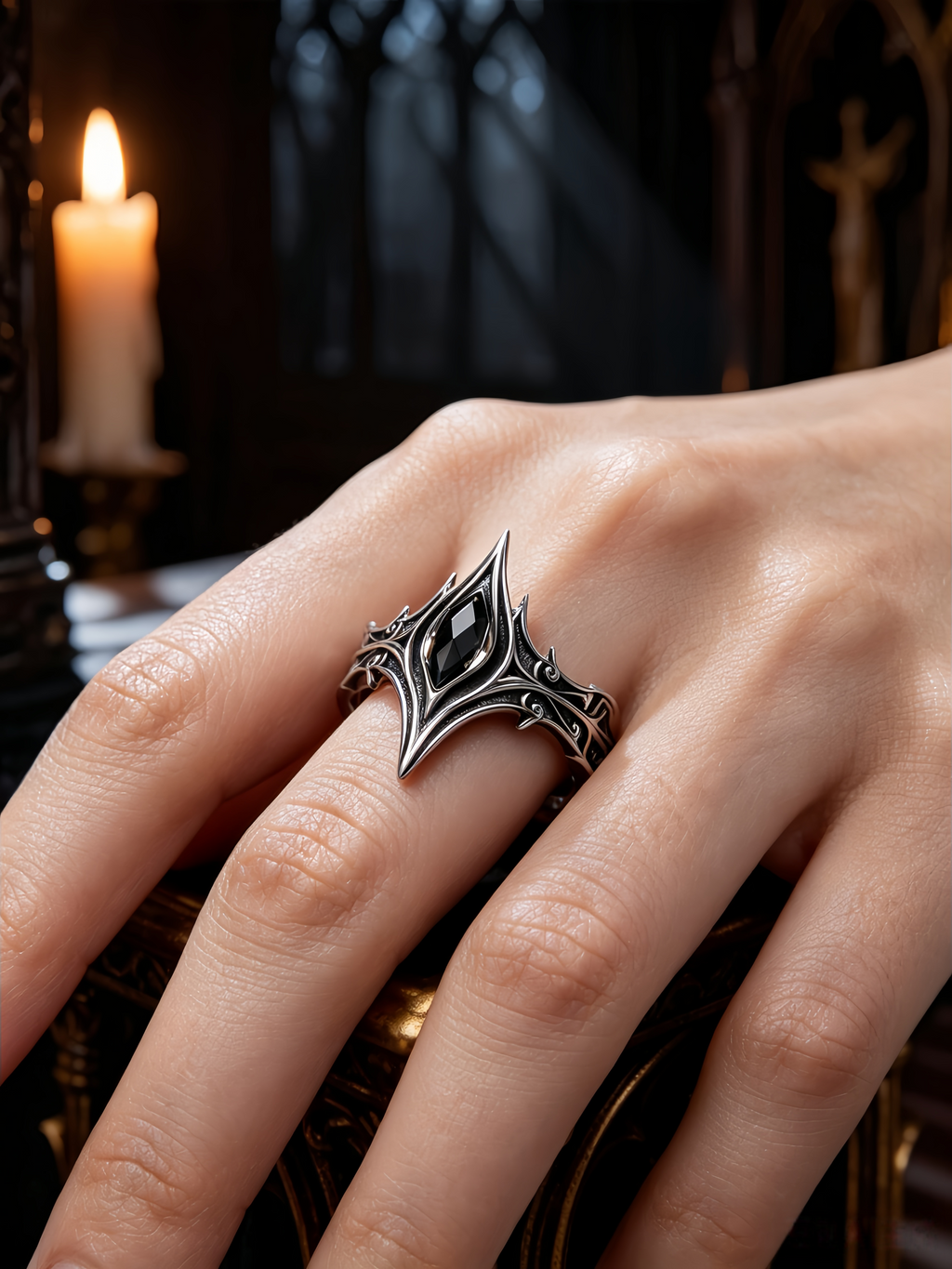 Woman wearing a gothic cathedral crown ring with marquise black onyx on hand, showing alternative engagement ring style in dark aesthetic by Kurga Atelier.