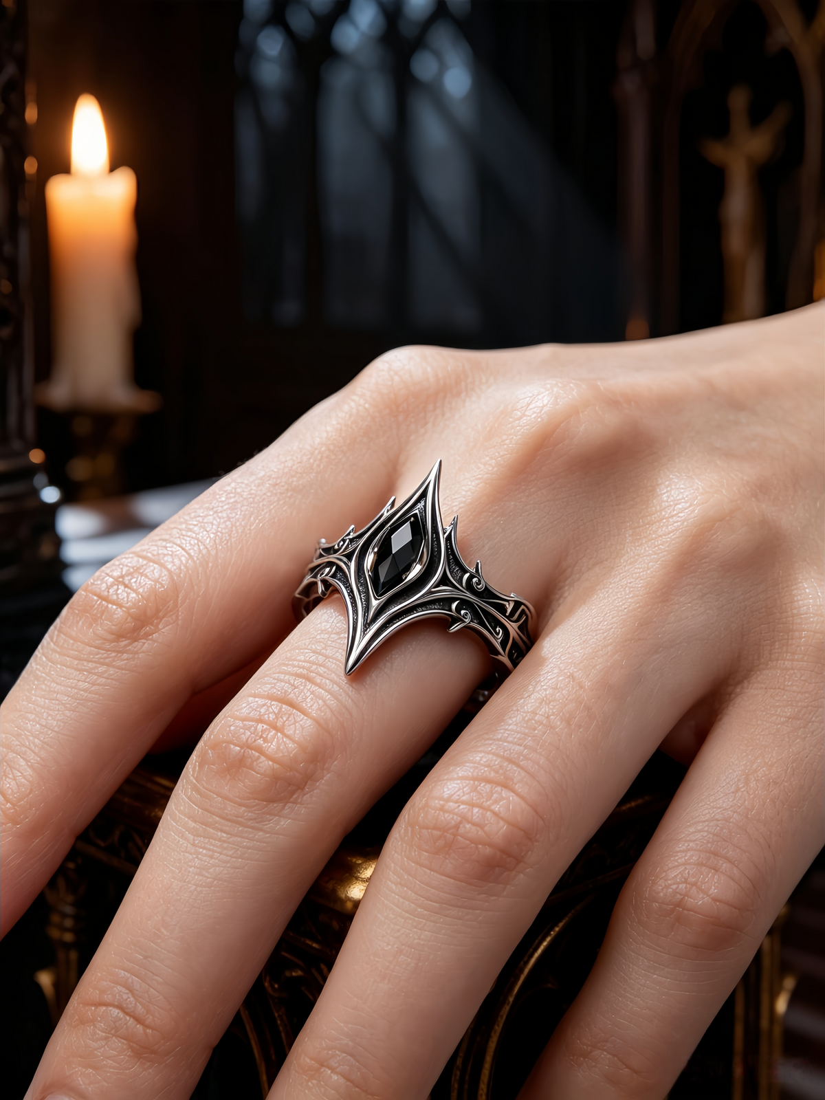 Woman wearing a gothic cathedral crown ring with marquise black onyx on hand, showing alternative engagement ring style in dark aesthetic by Kurga Atelier.